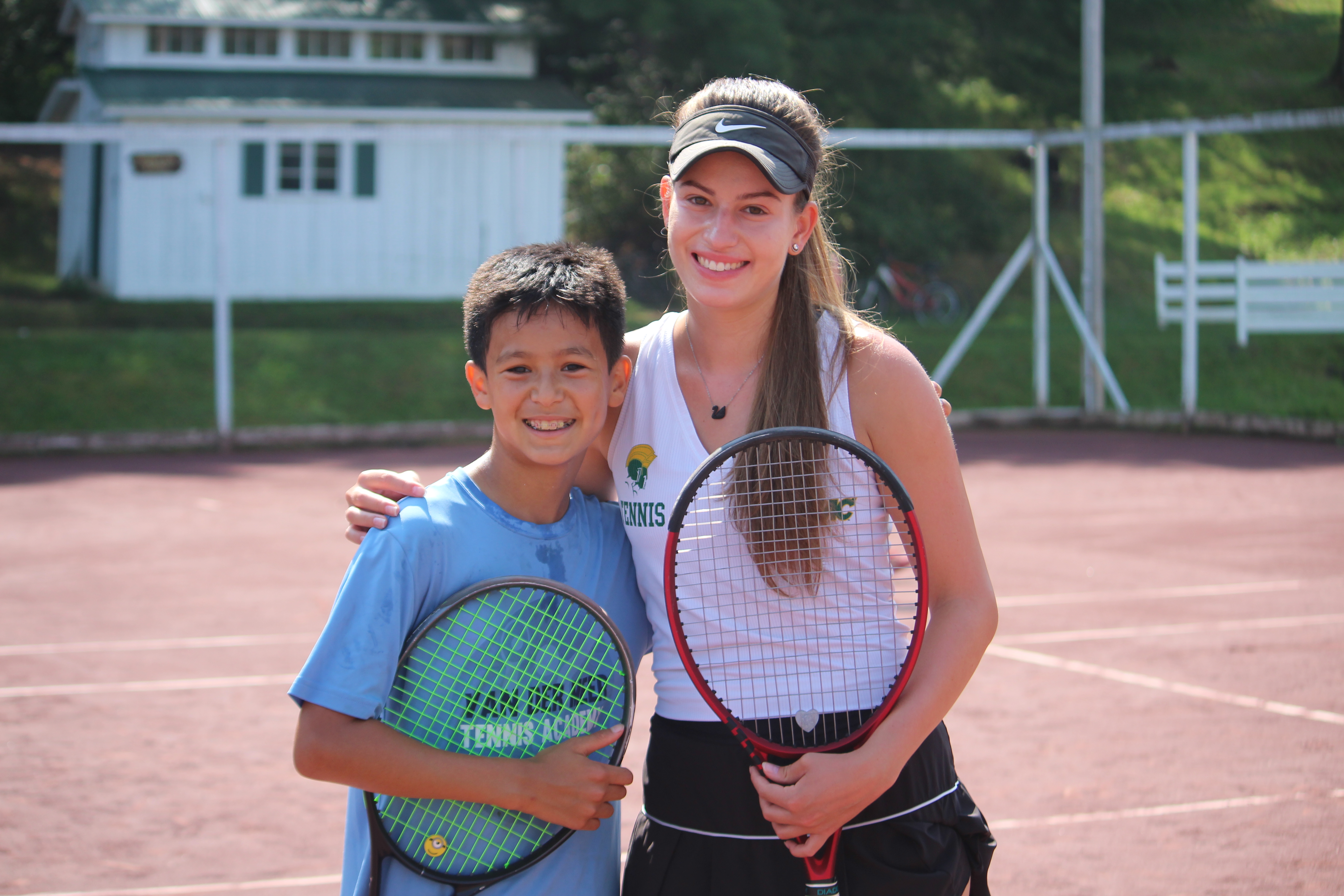A Windridge Camp tennis counselor with a camper